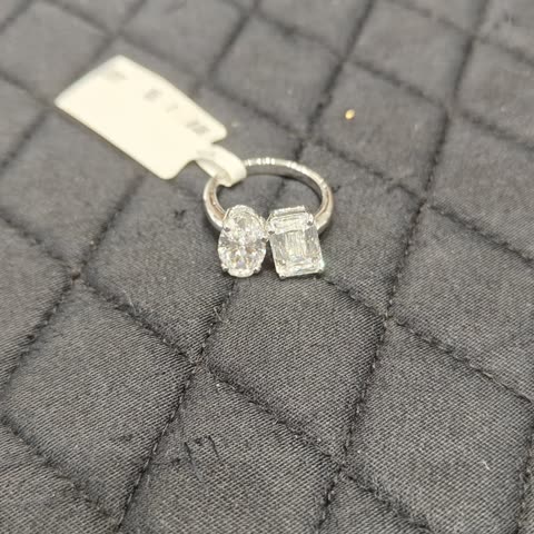 A 14K gold toi-et-moi ring set with two diamonds