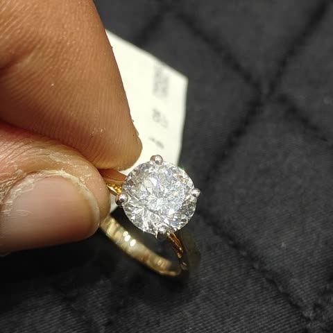 A 14K gold ring set with a Portuguese cut diamond